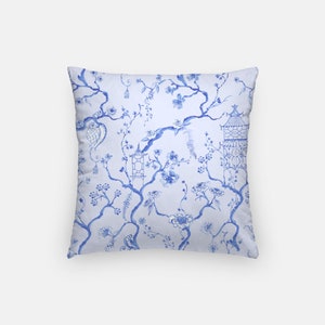 May include: Blue and white throw pillow with a floral pattern featuring a traditional Chinese design. The pillow has a square shape and a soft, comfortable feel.