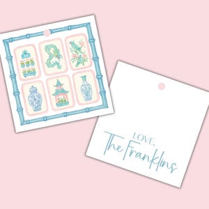 May include: Two gift tags on a pink background. One tag features a bamboo-style frame with six illustrations of Asian-inspired motifs in blue and pink. The second tag is white with the text "LOVE. The Franklins" in a light blue script.