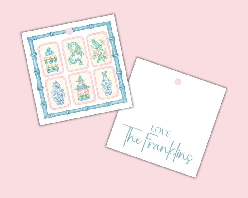 May include: Two gift tags on a pink background. One tag features a bamboo-style frame with six illustrations of Asian-inspired motifs in blue and pink. The second tag is white with the text "LOVE. The Franklins" in a light blue script.