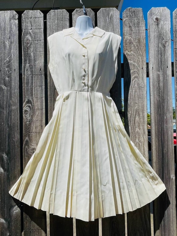 Distressed white pleated dress