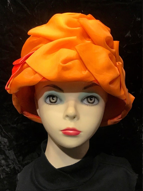 Orange crepe covered statement hat
