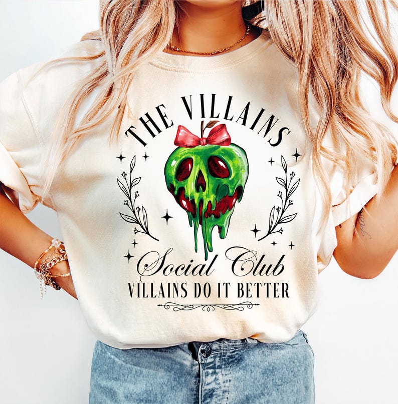 a woman wearing a white shirt with a skull on it