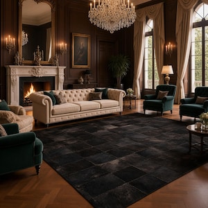 May include: A large rectangular area rug featuring a dark, checkered pattern made of square patches. The rug is positioned in a room with a tufted beige sofa, dark green armchairs, a fireplace, a crystal chandelier, and wood flooring.