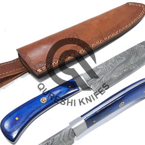 May include: A blue and silver Damascus steel knife with a blue wood handle and a brown leather sheath. The sheath has a decorative stitching pattern and a strap.