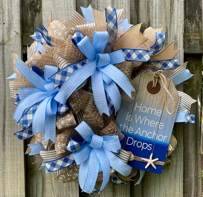 A close up of the wreath displayed on a weathered wood fence.