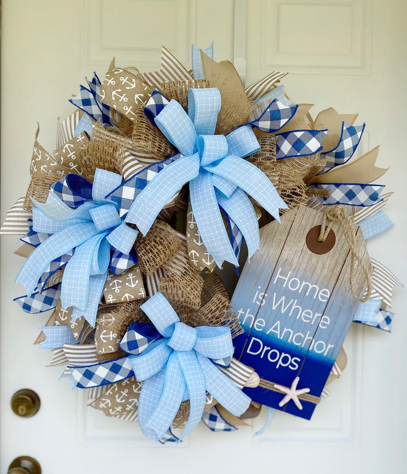 Displayed on a white exterior door, the wreath measures 28 inches in diameter and is approximately 10 inches deep.