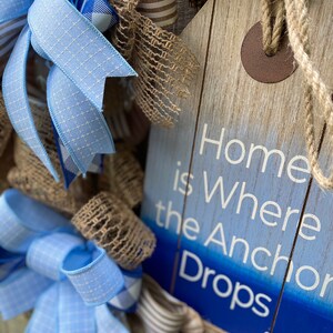 Close up of side view of the sign surrounded by the full fluffy bows.