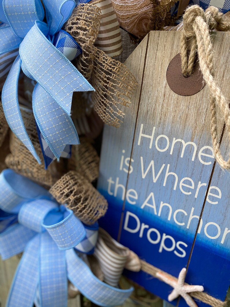 Close up of side view of the sign surrounded by the full fluffy bows.