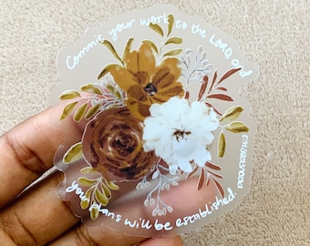 May include: A clear sticker with a floral design and the text "Commit your work to the Lord and your plans will be established."