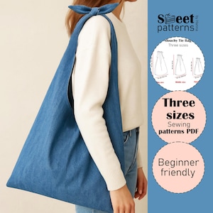 May include: A blue denim slouchy tie bag with a bow detail on the shoulder. The bag is shown being worn over the shoulder. The image includes text that says "Three sizes Sewing patterns PDF" and "Beginner friendly".