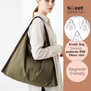 May include: An olive green tote bag with dark brown trim and straps. The bag is triangular in shape and is being carried over the shoulder. Text on the image reads "Trendy Bag Sewing patterns PDF Three size" and "Beginner friendly."