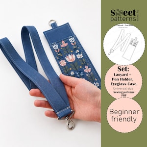 May include: A blue fabric lanyard and a matching rectangular fabric case featuring a floral pattern with pink, white, and blue flowers. The set includes a metal swivel clasp and a metal D-ring. Text on the image reads Sweet patterns, Set: Lanyard + Pen Holder, Eyeglass Case, Universal size Sewing patterns PDF, Beginner friendly.