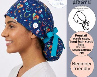 May include: A dark blue scrub cap featuring a colorful medical-themed print with stethoscopes, hearts, and pills. The cap includes a white side button, a teal ribbon tie at the back, and a gathered pouch for hair. Text includes Sweet patterns.