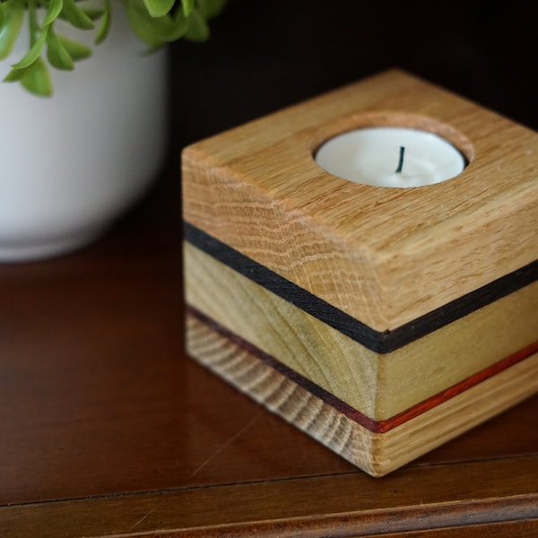 Votive candle holder handmade from five species of wood. Compliments cottage core or rustic decor. Nice 5th anniversary present.