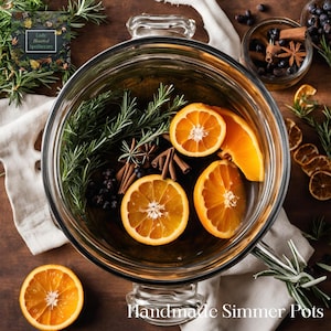 May include: A glass pot filled with water, orange slices, cinnamon sticks, star anise, and rosemary sprigs. The pot is on a wooden surface with a white cloth napkin and a small glass jar filled with berries and spices. The text "Handmade Simmer Pots" is visible at the bottom of the image.