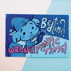 May include: A blue cartoon character in a nightcap is reading a book with the text "Wrong! Fanfic Time!" and "Bedtime?" in a speech bubble above the character.