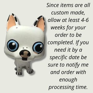 May include: A white and black custom-made figurine of a dog with blue eyes. The figurine is standing on a white background. The text "Since items are all custom made, allow at least 4-6 weeks for your order to be completed. If you need it by a specific date be sure to notify me and order with enough processing time." is written in black text on a white background.