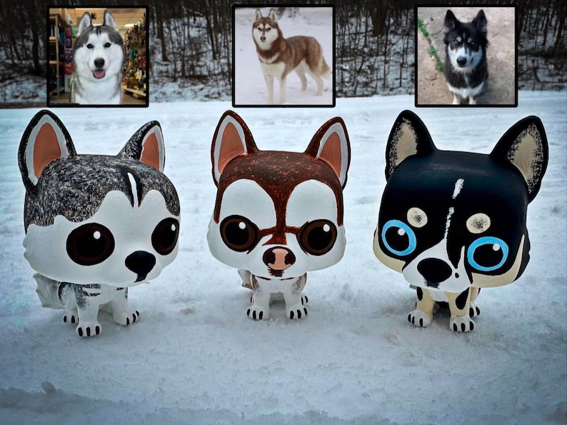 May include: Three custom-painted figurines of Siberian Huskies. The figurines are in a snow-covered setting. The first figurine is white and gray with black markings. The second figurine is brown and white with black markings. The third figurine is black with white markings.