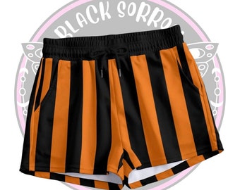 Casual circus striped shorts, vertical black orange stripy short pants, Halloween orange goth shorts