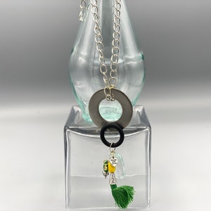 Silver necklace with rubber, crystal, metal, wood pendant