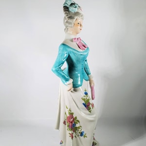 Vintage Handpainted Victorian Lady Porcelain Statue Figurine Blue Coat/Hat with Pink Scarf Bow
