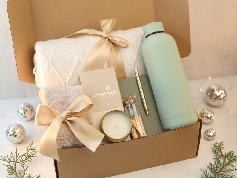A brown box with cozy gifts inside