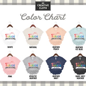 May include: Color chart showing different t-shirt colors available for a 1st grade teacher shirt. The shirt design features a rainbow apple with the text "1st Grade" and "Mr./Ms. [Last Name]" underneath.
