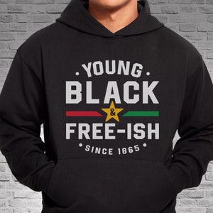 May include: Black hoodie with the text "Young Black & Free-ish Since 1865" in white lettering with a red, yellow, and green stripe.