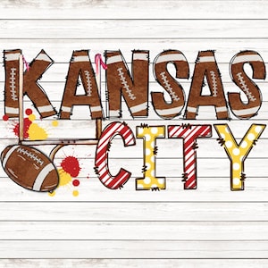 May include: A white wood background with the words "Kansas City" in brown, red, and yellow letters. The letters are decorated with stitching and stripes. A football is in the lower left corner.