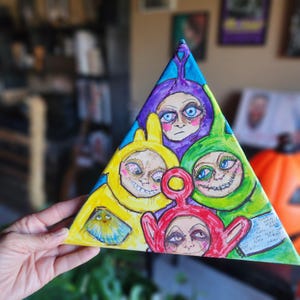 May include: A triangular canvas painting featuring four stylized figures in yellow, purple, green, and red. Each figure has a distorted face with large eyes and a sinister expression. The background is a mix of blue and white.