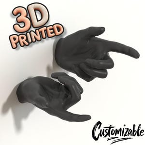 May include: Two 3D printed black hands pointing in different directions. The text "3D PRINTED" and "Customizable" are visible in the image.