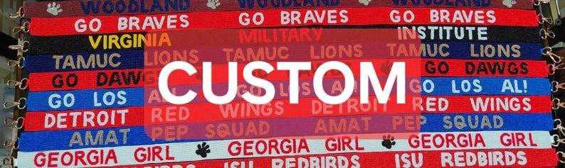 May include: A close-up of a colorful fabric banner with the word "CUSTOM" in white letters. The banner is made up of multiple strips of fabric, each with a different color and text. The text includes team names, slogans, and locations.