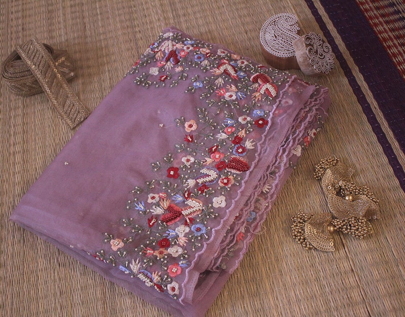 Folded saree view highlighting organza silk texture and embroidery
