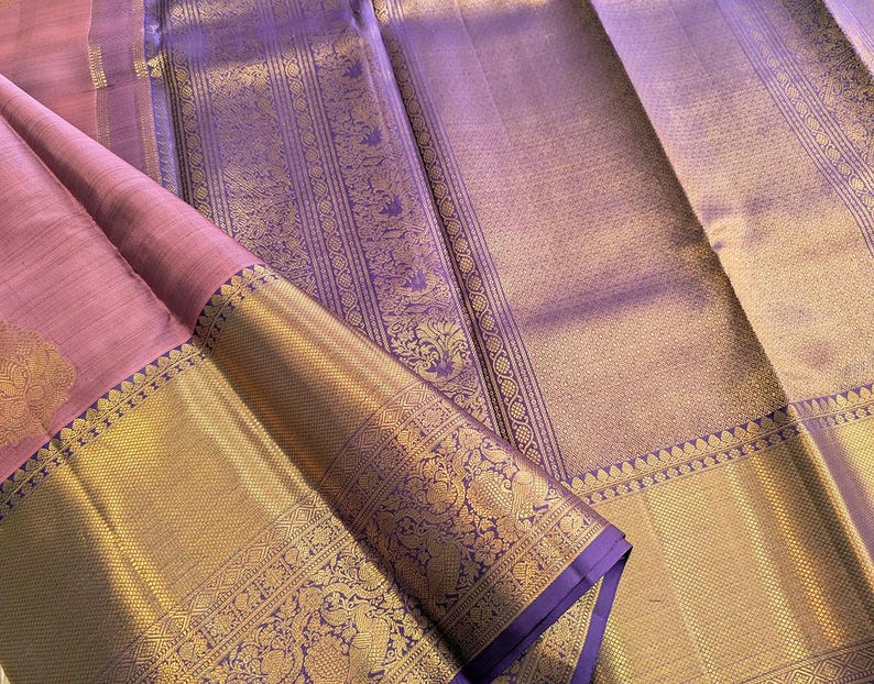 Styled pleats view of mauve kanjivaram silk saree