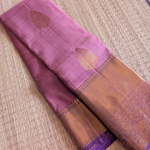 Folded saree view highlighting kanchipuram weave and zari work