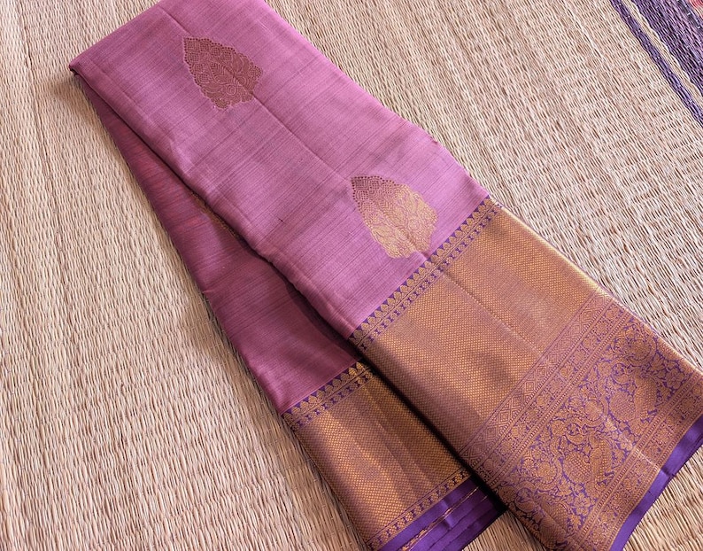 Folded saree view highlighting kanchipuram weave and zari work