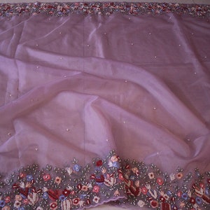 Saree body view with lilac organza silk fabric and embroidered motifs