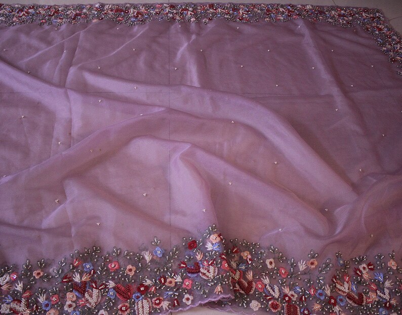 Saree body view with lilac organza silk fabric and embroidered motifs