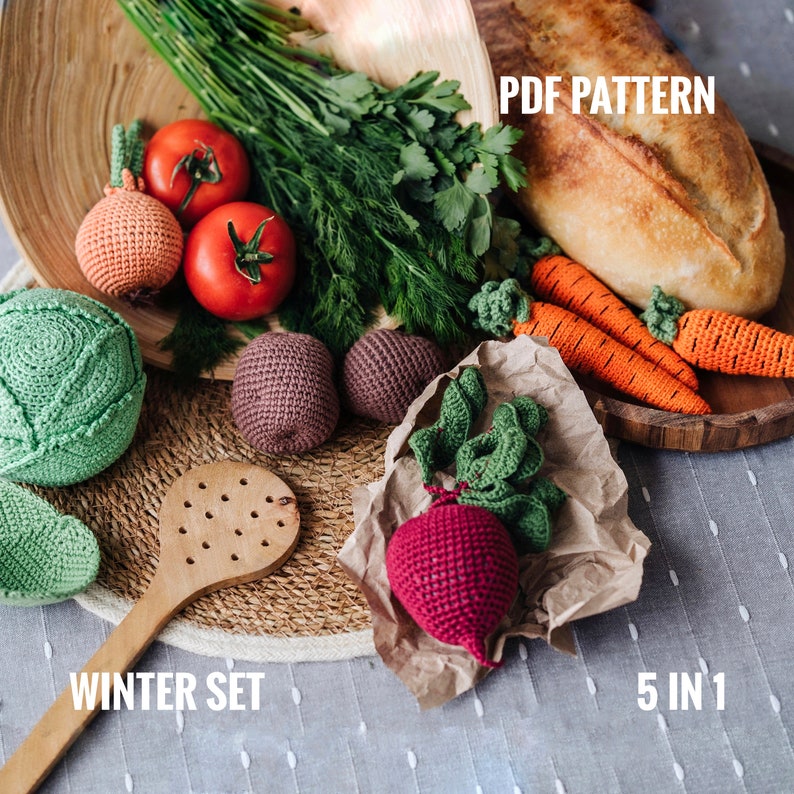 May include: A crochet winter vegetable set with five pieces: a cabbage, a beet, two carrots, and an onion. The set is displayed on a wooden tray with a loaf of bread and fresh herbs. The text "PDF PATTERN" and "WINTER SET" are visible in the image. The text "5 IN 1" is also visible in the image.