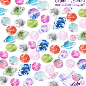 May include: A sheet of colourful planet stickers with a variety of colours and designs. The stickers are in a small box with the text "Minnie Stickers" and "minniestickers.etsy.com".