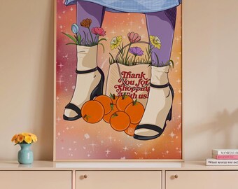 May include: A framed art print featuring a stylized illustration. The artwork depicts legs in purple leggings and white heeled boots, with flowers sprouting from the boots. A shopping bag with the text "Thank You for Shopping with us!" is present, along with oranges.