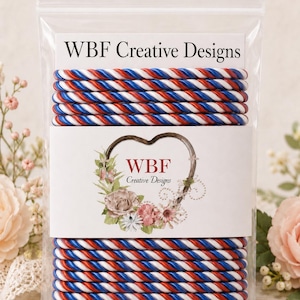 May include: A clear plastic bag containing multiple red, white, and blue twisted rope cords. The packaging features a white label with the text WBF Creative Designs and a heart-shaped floral graphic with the WBF Creative Designs logo inside.