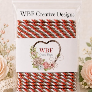 May include: A clear plastic bag containing multiple lengths of twisted cord in alternating red, white, and metallic bronze colors. The packaging features a white label with the text WBF Creative Designs and a floral heart graphic.