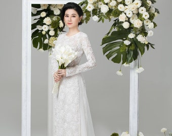 Gorgeous white Vietnamese wedding ao dai with floral lace and beading made to order