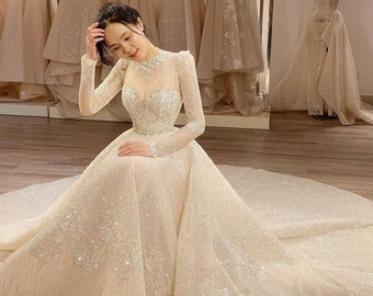 Unique crystal sparkling lace princess wedding dress made to order, luxury beaded long sleeve bridal gown for a fairy tail wedding