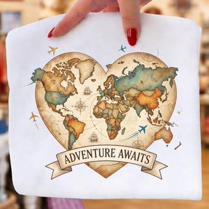 May include: White tote bag featuring a heart-shaped world map design with the text "ADVENTURE AWAITS". The map is in shades of brown, blue, and orange, with small airplane illustrations. The bag is held by a person.