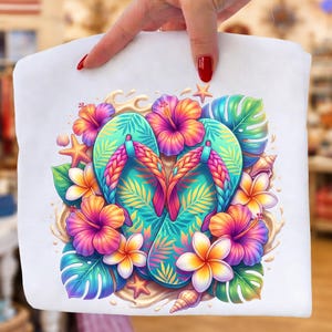 May include: White tote bag featuring a vibrant illustration of turquoise flip-flops adorned with tropical flowers and leaves. The design includes hibiscus, plumeria, and starfish, with the text "High Quality PNG / Digital Downloa".