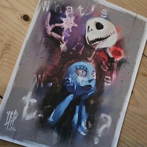 May include: A print featuring characters from "The Nightmare Before Christmas." The artwork includes Jack Skellington, Sally, and the text "What's this?" in a stylized, artistic design with a dark, moody color palette.