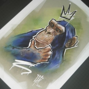 May include: A blue and brown chimpanzee with a crown on its head. The chimpanzee is looking to the right and has its hand raised in a gesture of greeting. The background is a green and brown watercolor wash.