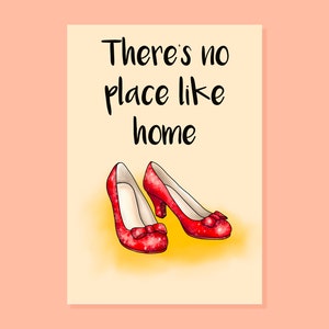 May include: A card with the text "There's no place like home" and a pair of red sparkly shoes.